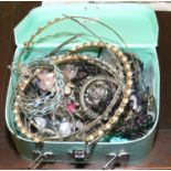 A novelty jewellery box and contents of costume jewellery including hardstone set examples, beads,