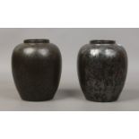 Two Poole pottery vases.