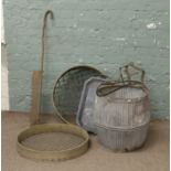 A dolly tub, three riddles and a quantity of garden/agricultural equipment.