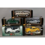 Five boxed 1/18 scale Diecast model vehicles by Burago and Maisto including Volkswagon, Mclaren,