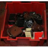 A box of vintage cameras and photography equipment to include Kodak, Olympus etc.