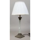 A frosted cloud glass column tablelamp with pleated grey silk shade.