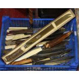 A box of vintage carving knives and bread knives including stag antler and silver plate etc.