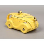 A Sadler Art Deco yellow ground novelty teapot formed as a racing car.