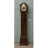 A mahogany cased grandmother clock with Westminster chime.