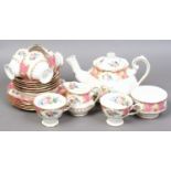 A Royal Albert six place teaset including teapot. Decorated in the Lady Caryle pattern.