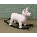 A childs novelty rocking horse formed as a pig.