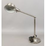 A adjustable brushed chrome reading lamp.