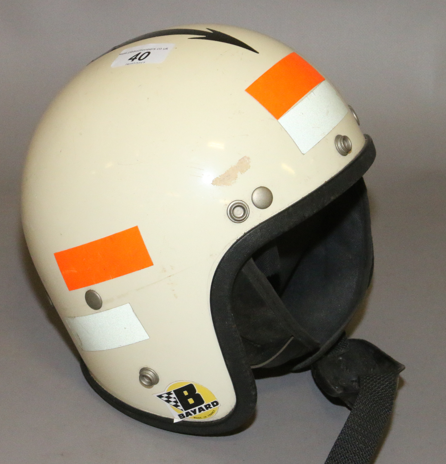 A 1960s open face motor cycle helmet.