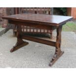 An oak extending refectory table.