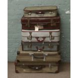 A collection of assorted suitcases.