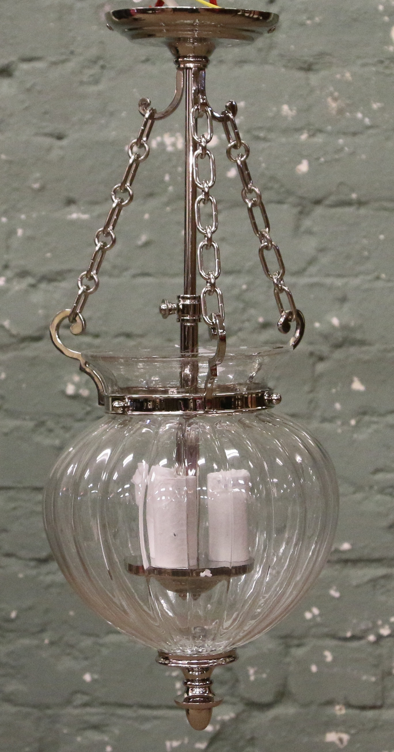 A Chrome three branch hall lantern with ribbed clear glass inverted dome shaped shade.