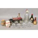 A novelty musical decanter and glass et, along with Wade decanters, E.