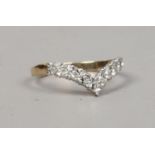 A 9ct gold diamond set wishbone ring, size L1/2.