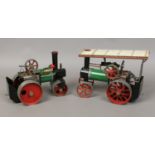 A vintage manual steam roller and a traction engine