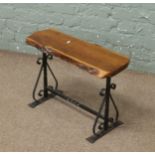 A rectangular yew wood and wrought iron occasional side table.