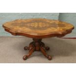 A centre pedestal inlaid coffee table.