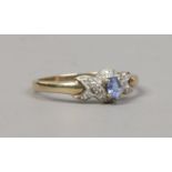 A 9ct gold tanzanite and diamond dress ring, size Q 1/2.