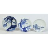 Three Japanese blue and white dishes including a Nabeshima dish painted with flowering bulbs and a