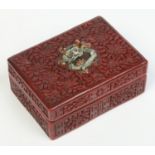 An early 20th century Chinese cinnabar lacquer box and cover of rectangular form.