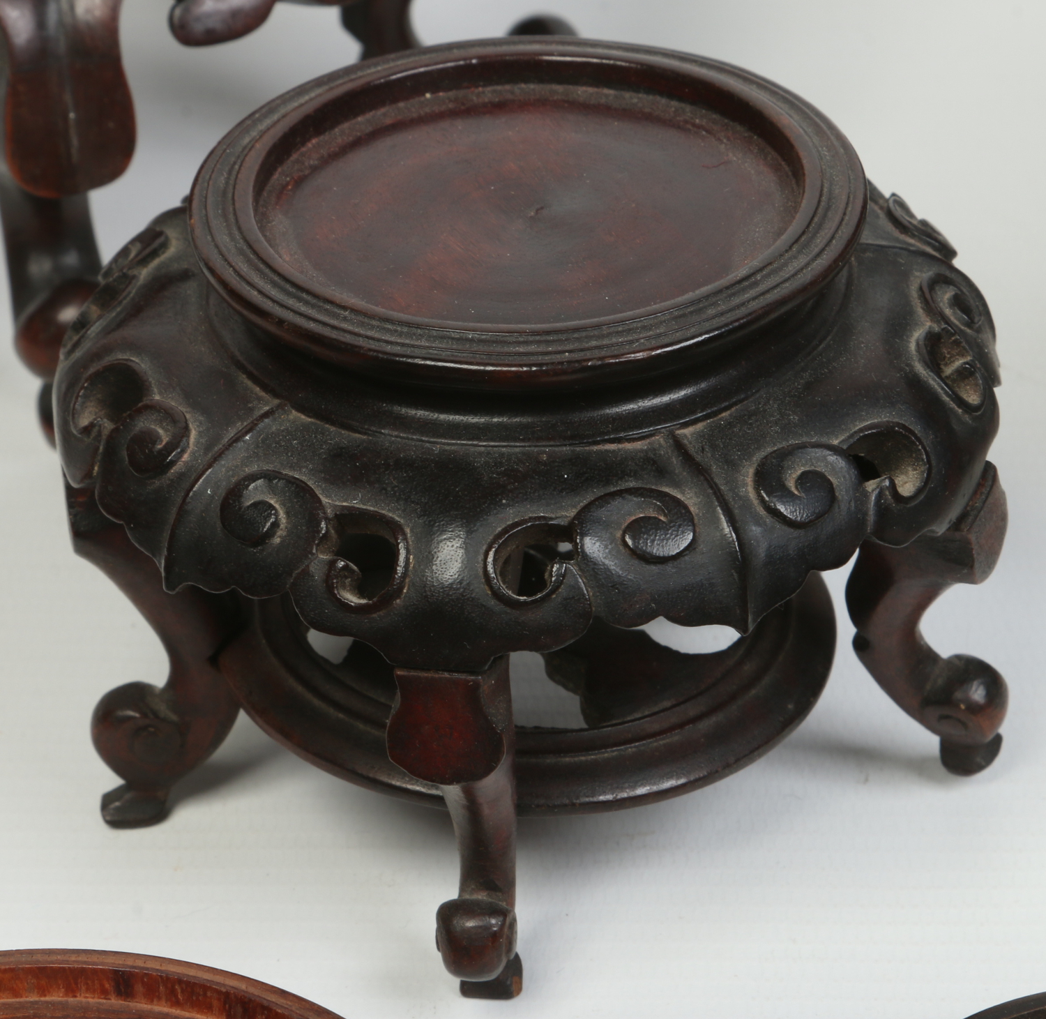 A collection of carved hardwood Japanese and Chinese stands and covers, 19th and 20th century. - Image 4 of 5