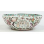 A Sampson famille rose punch bowl. Decorated with figures, butterflies and flowers, 27cm diameter.