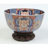 A large Japanese Meiji period bowl and hardwood stand.