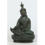 An antique Oriental bronze figure of a seated Buddha, 3108 grams, 34cm. Condition Report.