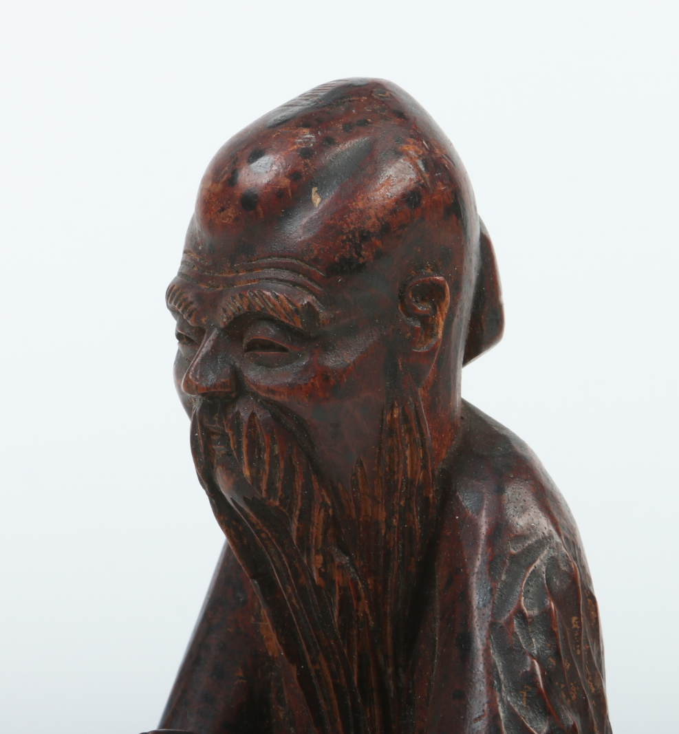 A 19th century Chinese carved and stained wood figure of a sage raised on associated carved - Image 2 of 4