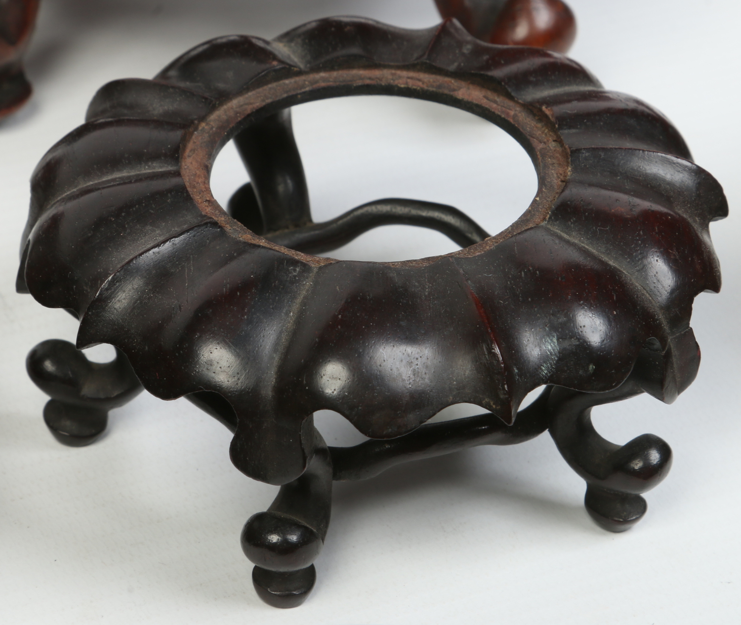 A collection of carved hardwood Japanese and Chinese stands and covers, 19th and 20th century. - Image 3 of 5