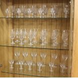 A suite of cut glass drinking glasses comprising of seven sets of six for champagne wine etc.