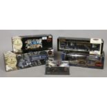 Five boxed Guinness advertising diecast model vehicles including Corgi examples.