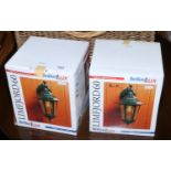 A pair of new and boxed black Diecast alluminium outdoor wall lanterns.