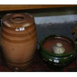 A Lambeth salt glazed spirit flagon along with a green glazed planter (AF) and a stoneware hot