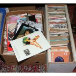 Two boxes of 45rpm record singles including picture sleeves and a small collection of music books