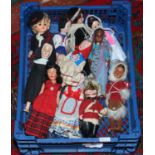 A group of vintage world dolls in various costumes of the nations.