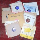 A collection of 78s including Buddy Holly, Elvis Presley etc.