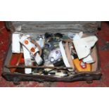 A vintage leather suitcase and contents of military patches, plaques, World War II splint strap etc.