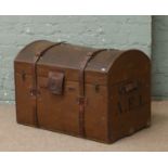 A vintage dome top leather and canvas travel trunk monogrammed A.E.L by G.G.Peterkin of Aberdeen.