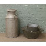 A vintage galvanized milk churn along with two galvanized buckets and a twin handled basin.