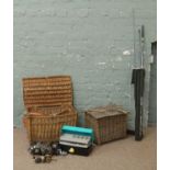 Two wicker fishing baskets and contents of fishing reels floats,