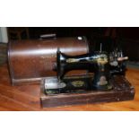 An oak cased singer sewing machine.