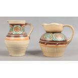 Two Royal Cauldron pottery jugs with tube lined decoration by Edith Gater.