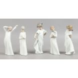 Five Nao figures modelled as children in night clothes.