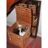 A twin handled basket and contents to include magnifying glass and telescope set, leather goods,