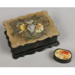A Victorian lacquered box with abalone shell inlay along with an ebonized snuff box.