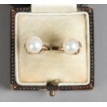 A pair of 9ct gold and cultured pearl ear clips.