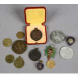 A quantity of coins and medals including commemorative examples.