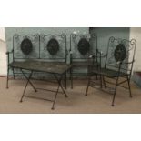 A painted metal wirework four part patio set.