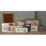 A collection of pictures, prints and wall plaques.